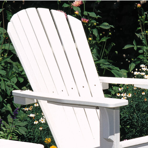 White lawn chair set in front garden