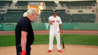 Devers teaches Eliot how to swing a bat