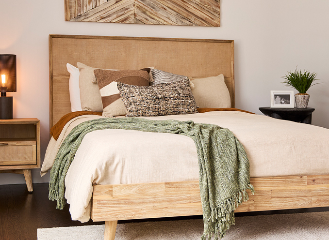 A serene bedroom showcasing a wooden headboard and a well-arranged bed, emphasizing comfort and style.