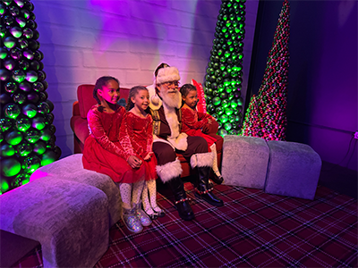 Children sitting with Santa