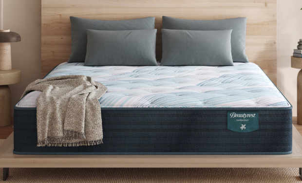 Mattress with a soothing blue cover for ultimate comfort.