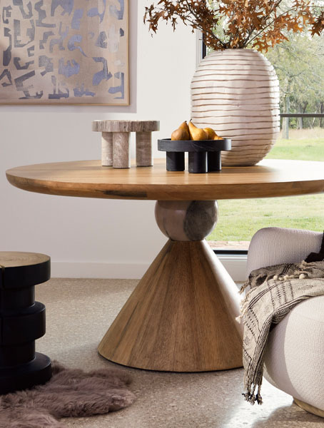 Wooden round dining table, elegant and sturdy.