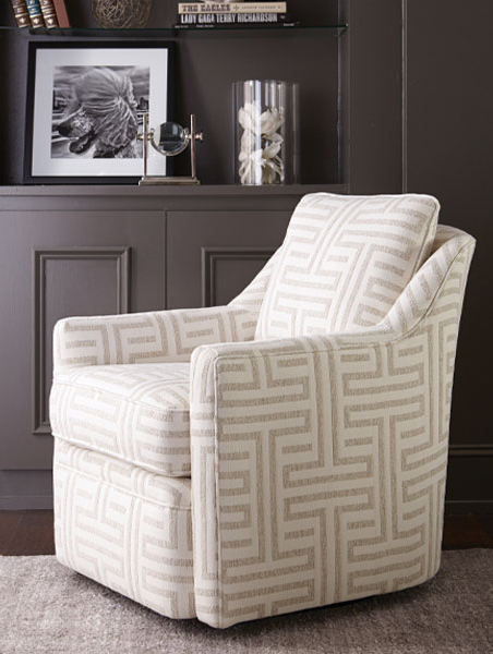 A contemporary chair set in a chic living room, highlighting modern aesthetics and a cozy atmosphere.