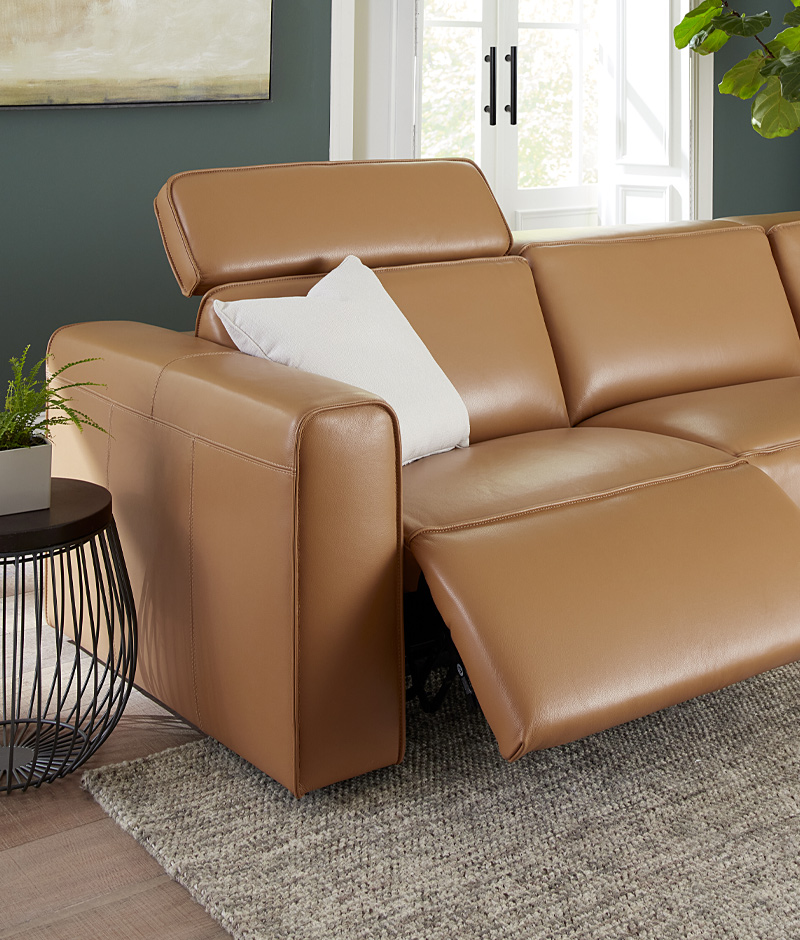 A modern leather sectional sofa elegantly positioned in a stylish room, showcasing contemporary design and comfort.