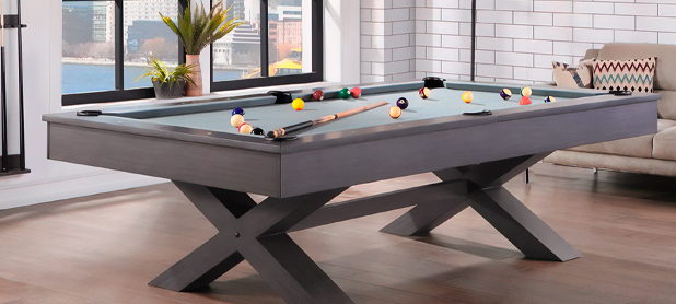 A pool table covered with a sleek black and gray cloth, showcasing its elegant design and professional appearance.